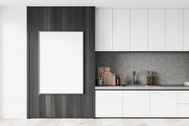 Interior of modern kitchen with white and concrete walls, wooden floor, white counters with built in sink and cooker and vertical mock up poster on dark wooden wall. 3d rendering