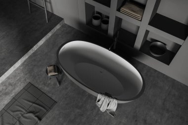 Top view of dark bathroom interior with bathtub and carpet on grey concrete floor. Bathing corner with shelf and accessories. 3D rendering