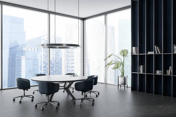 Corner view on dark office room interior with meeting board, table, desk, armchairs, panoramic window with Singapore view, bookshelf, concrete floor. Concept of conference hall. 3d rendering