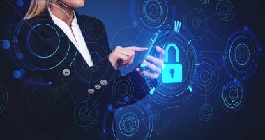 Unrecognizable young businesswoman using smartphone over dark blue background with double exposure of blurry cryptocurrency interface. Concept of data protection