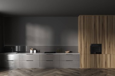 Gri duvarları, koyu ahşap zemini, lavabosu, ocağı ve ahşap dolabı olan gri dolapları olan minimalist mutfağın içi. 3d oluşturma