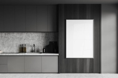 Gri ve beton duvarları olan şık bir mutfak, beton zemin, lavabo ve ocağın içine monte edilmiş gri tezgahlar ve koyu ahşap duvarda asılı dikey maket posterler. 3d oluşturma