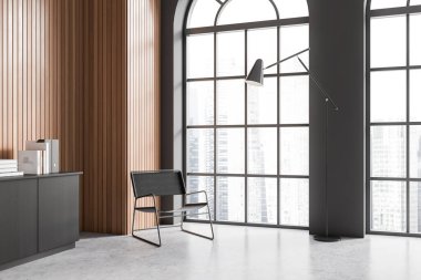 Koyu gri ve ahşap duvarları olan şık bir ofisin köşesi, beton zemin, pencerenin yanında bulanık şehir manzarası ve gri dosya dolabı olan gri koltuk. 3d oluşturma