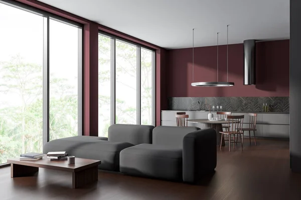 现代客厅的内部有红墙 深色木地板 灰色沙发和厨房与餐桌和灰色橱柜 全景窗 山景朦胧 3D渲染 — 图库照片