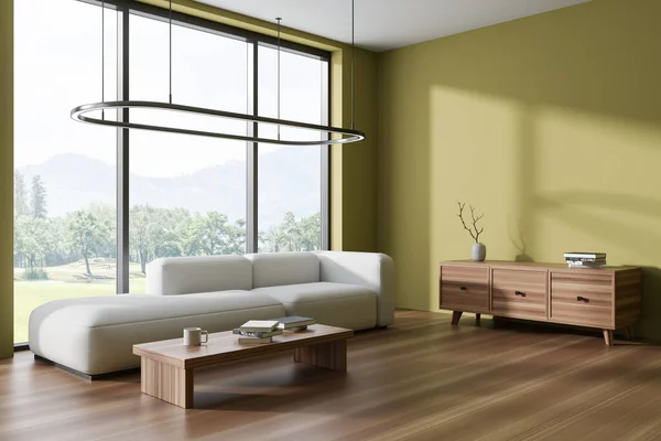Corner of stylish living room with dark yellow walls, stylish white sofa, coffee table and wooden cabinet. Panoramic window with blurry mountain view. 3d rendering