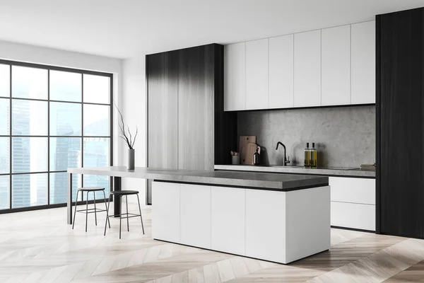 Corner of modern kitchen with white walls, wooden floor, white and wooden cabinets and bar counter with stools. Window with blurry cityscape. 3d rendering