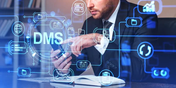 stock image Businessman working with smartphone, double exposure hologram with DMS. Automation software to archiving and efficiently manage files and information. Concept of mobile app