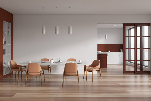Interior of modern dining room with white and brown walls, wooden floor, long dining table with chairs and kitchen with cabinets in the background. 3d rendering