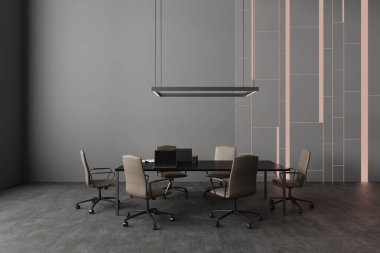 Gri duvarları, beton zemini ve dizüstü bilgisayarları ve sandalyeleri olan şık, fütüristik toplantı odasının içi. 3d oluşturma