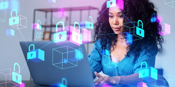Black woman using laptop, glowing padlock icon with data blocks. Double exposure with blockchain and data protection in cyberspace. Concept of internet privacy
