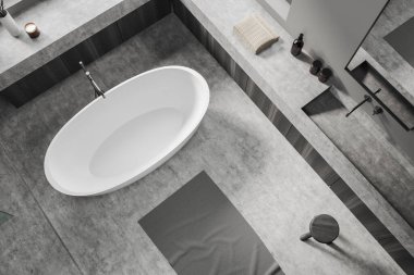 Gri beton zeminde küvetli banyo manzarası. Lavabo ve aynalı lavabo, aksesuarlar güvertede. 3B görüntüleme