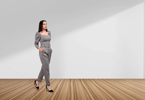 Thoughtful Businesswoman Walking Hands Pocket Hardwood Floor White Copy Space — Stock Photo, Image