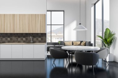 İçi yemek masası ve sandalyelerle dolu beyaz stüdyo, köşesinde kanepe olan oturma odası. Mutfak rafları ve koyu beton zemin. Kırsal alanda panoramik pencere. 3B görüntüleme