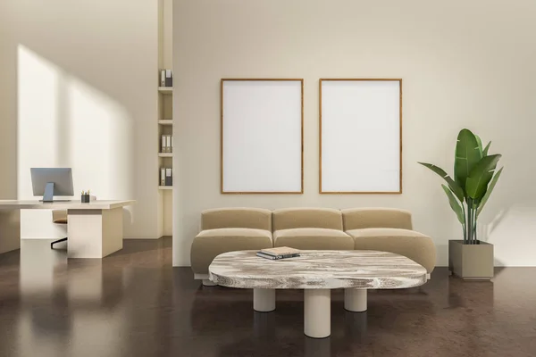 Beige business room interior with chill zone with sofa and coffee table, work desk with pc computer on dark concrete floor. Two mockup posters. 3D rendering