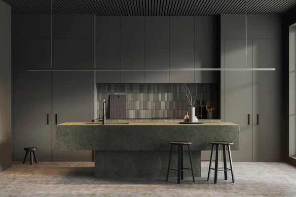 Minimalist home kitchen interior with stone bar island, two stool and shelves with kitchenware. Modern cooking and dining area on grey concrete floor. 3D rendering