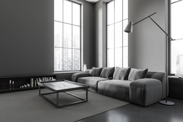 Dark living room interior with dark sofa, side view, coffee table and drawer with decoration on grey concrete floor. Modern chill corner with panoramic window on Singapore city view. 3D rendering