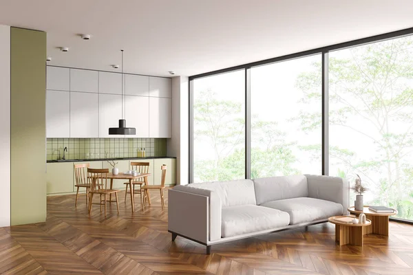 スタイリッシュなキッチンのインテリアと緑と白の壁 木製の床 シンクと調理器と椅子付きの正方形のダイニングテーブルを内蔵した緑のキャビネット 居心地の良い白いソファ 3Dレンダリング — ストック写真