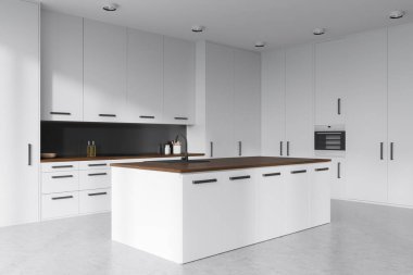 Ada dolabı ve yan manzaralı beyaz yemek pişirme. Fırına monte edilmiş, gri beton zemini olan yemek pişirme alanı. Modern minimalist mutfak ve şık mobilyalar. 3B görüntüleme
