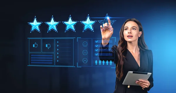 Businesswoman with tablet in hand, finger touch virtual screen with feedback and rating dashboard, giving five stars for customer service. Concept of online review and satisfaction