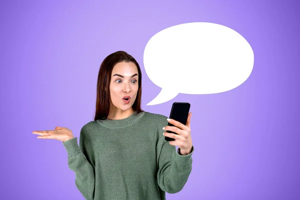 Surprised woman on a video call, hand gesturing and happy look. Social media and mobile app on purple background. Concept of idea. Mockup blank thought bubble