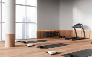 Minimalist sport room interior with treadmill and yoga mat in row on hardwood floor. Dumbbell storage rack, side view panoramic window on Singapore skyscrapers. 3D rendering clipart