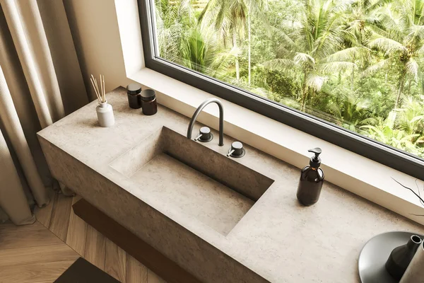 Top view of beige bathroom interior with sink and panoramic window on tropics. Washbasin in modern hotel studio corner with bath accessories. 3D rendering