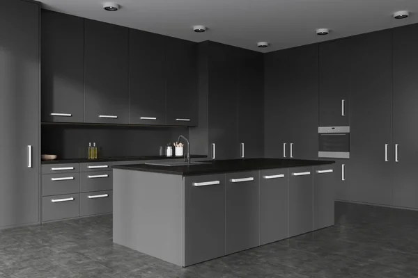 黑暗的烹饪内部与岛屿橱柜 侧视图 烹调空间与烤箱安装 灰色混凝土地面 奢华的厨房 配有现代家具 3D渲染 — 图库照片