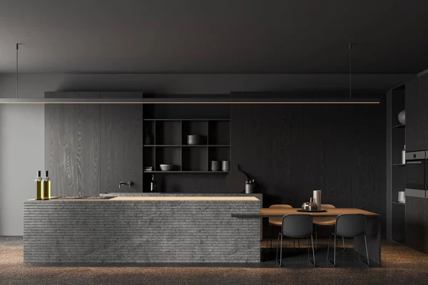 Dark home kitchen interior with stone bar island on grey concrete floor. Cooking and eating area with dinner table and kitchenware on shelves. 3D rendering