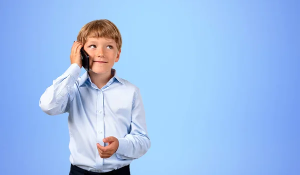 Portrait Adorable Smiling Little Boy Talking Smartphone Blue Background Concept — Stock Photo, Image