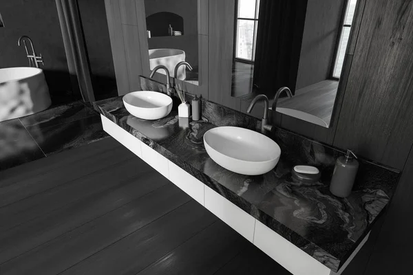 Top view of bathroom interior with double sink and mirror, window on Singapore city view. Bathtub and bath accessories on marble deck. 3D rendering