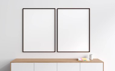 Modern oturma odasının içi ahşap şifoniyerle ve şık sanat dekorasyonlarıyla kitaplar, minimalist İskandinav tasarımı. Sıraya dizilmiş iki tane tuval posteri. 3B görüntüleme