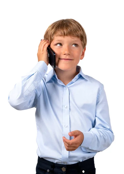 Zasněný Usměvavý Chlapec Volá Telefonu Oblečený Modré Košili Izolované Bílém — Stock fotografie