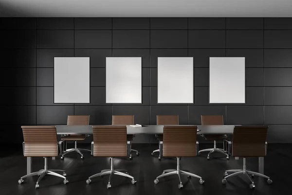 Dark minimalist office interior with conference table, armchairs on black hardwood floor. Meeting place with modern furniture and four mock up canvas posters in row. 3D rendering