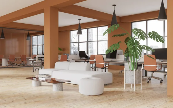 Corner of stylish office waiting room with orange walls, wooden floor, comfortable white sofa, coffee table and open space area in the background. 3d rendering