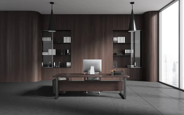 Interior of stylish CEO office with dark wooden walls, concrete floor, computer table and bookcases with folders. 3d rendering