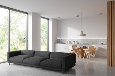 Beyaz stüdyo içi kanepe ve yemek masası, yan görüş, tropik manzaralı panoramik pencere. Mutfak gereçleri ve gevşeme alanı olan yemek pişirme alanı, açık beton zemin. 3B görüntüleme