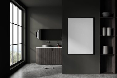 Koyu gri duvarları, beton zemini, koyu ahşap dolapta duran rahat lavabosu ve oval aynası olan şık bir banyo. Dikey model poster çerçevesi. 3d oluşturma