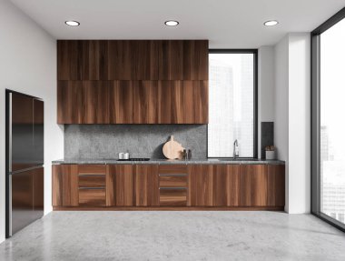 Beyaz duvarları, beton zemini, karanlık ahşap dolapları, lavabo, fırın ve büyük buzdolabı ile döşenmiş şık bir mutfak. 3d oluşturma