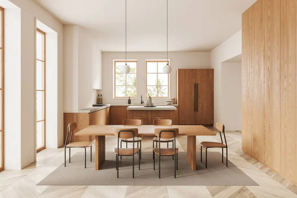 米色家庭厨房内部与餐桌和椅子地毯 酒吧岛 冰箱和木制架子与厨房用具 舒适的做饭和吃饭的空间与全景窗 3D渲染 — 图库照片