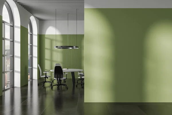 Interior of stylish office meeting room with green walls, tiled floor, round conference table with chairs and arched windows. Mock up wall on the right. 3d rendering