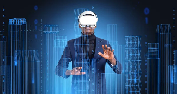 Black businessman working in vr glasses. City buildings wireframe, skyscrapers in matrix hologram hud. Concept of futuristic technology, virtual reality and business in metaverse
