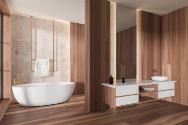 Ahşap otel banyosunun içi lavabo ve aynalı, yan manzaralı, tırabzanda havlu olan beyaz küvet, altın musluk ve ahşap zemin. 3B görüntüleme