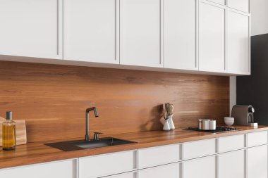 Mutfağın içi lavabo, yan görüş, soba ve modern mutfak gereçleriyle dolu. Minimalist otel stüdyosunda yemek pişirme alanı. 3B görüntüleme