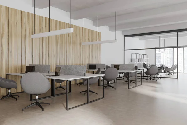 stock image Corner view on bright office interior with panoramic windows with Singapore city view, desks with armchairs, laptops, glass partition and concrete floor. Concept of place for coworking. 3d rendering