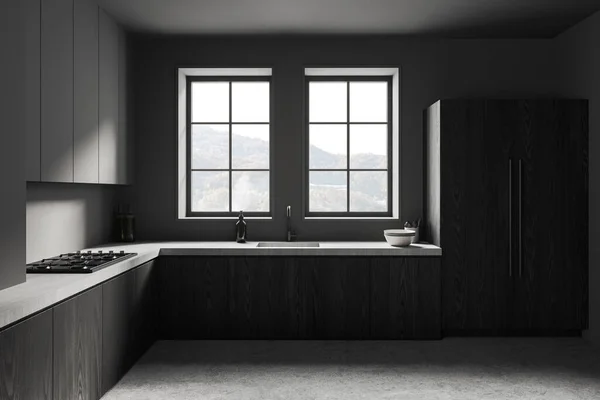 现代化厨房的内部 有灰色的墙壁 混凝土地面 灰色的橱柜和深色的木制橱柜 内置炊具 上面有两个窗户 3D渲染 — 图库照片