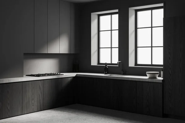 现代化厨房的角落 有灰色的墙壁 混凝土地面 灰色的橱柜和深色的木制橱柜 里面有炊具 上面有两扇窗户 3D渲染 — 图库照片