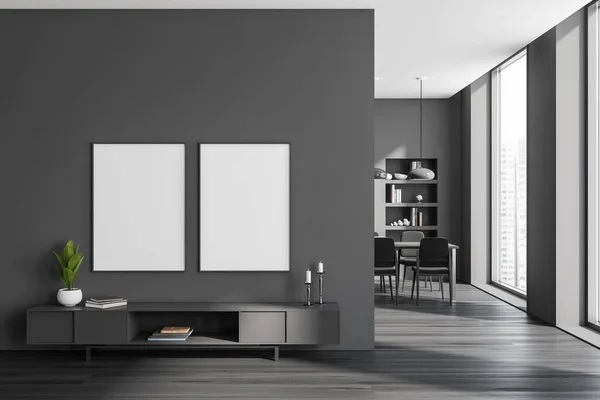 Dark living room interior with sideboard and candle, meeting room with chairs and table, shelf with decoration. Panoramic window on city skyscrapers. Two mockup posters. 3D rendering