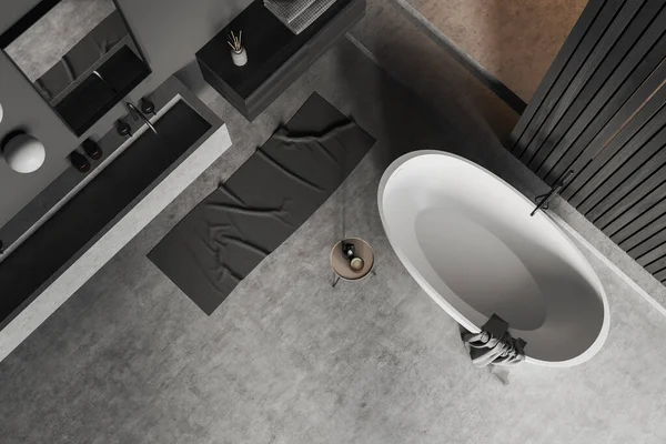 グレーのコンクリート床にバスタブ付きのバスルームのインテリアのトップビュー シンクとミラー ドレッサーのアクセサリーとホテルの入浴コーナー 3Dレンダリング — ストック写真