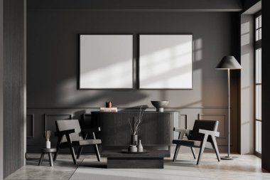 Gri duvarları, beton zemini, sehpanın yanında duran iki rahat koltuğu ve üzerinde iki kare maket posterleri olan koyu renkli ahşap şifoniyeri olan şık bir oturma odası. 3d oluşturma