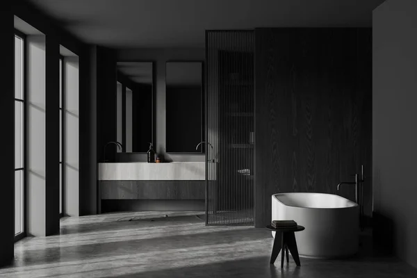 时尚浴室的内部 有灰色和黑色的木制墙壁 混凝土地面 巨大的石制双水池 上面有两个镜子和舒适的白色浴缸 3D渲染 — 图库照片